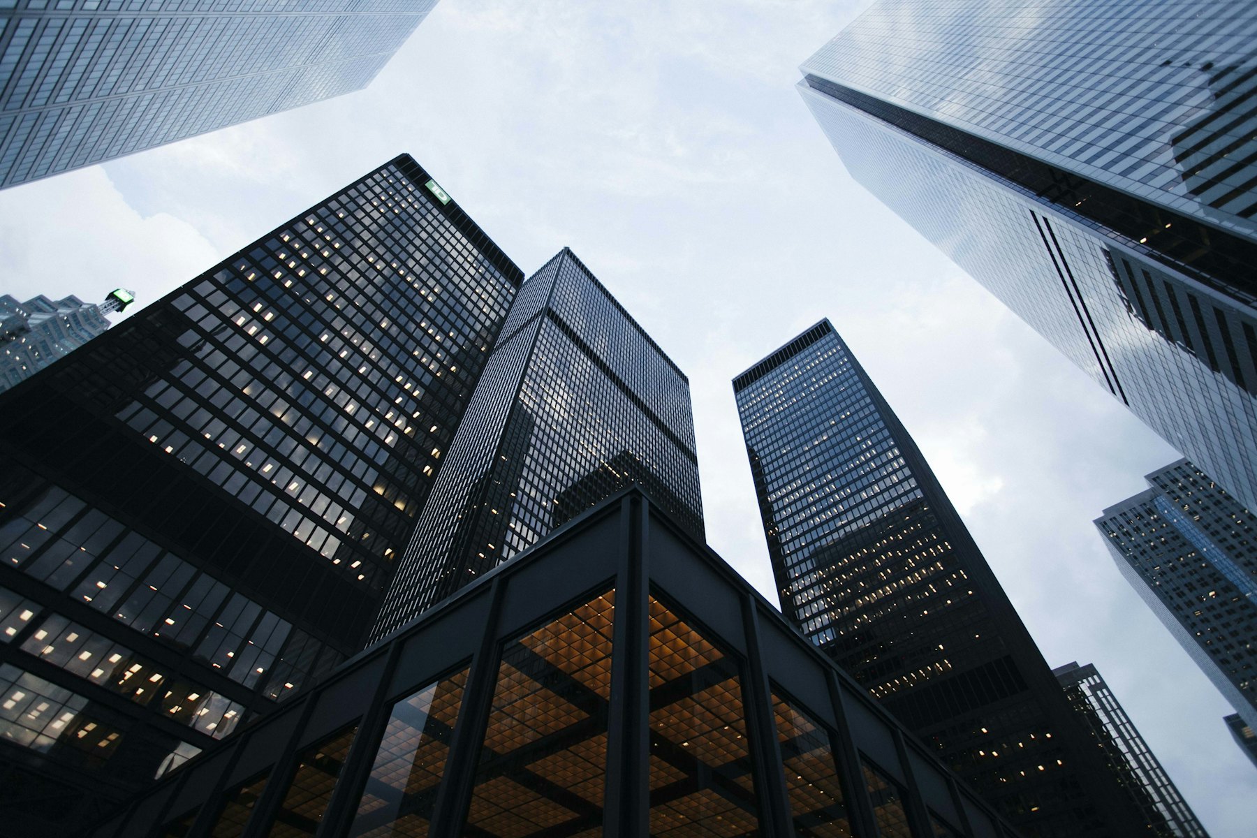 Office towers seen looking upward at dusk.